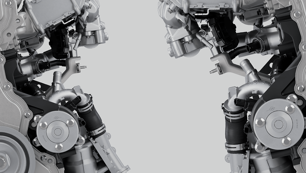 A close up of two almost mirrored looking parts of an engine