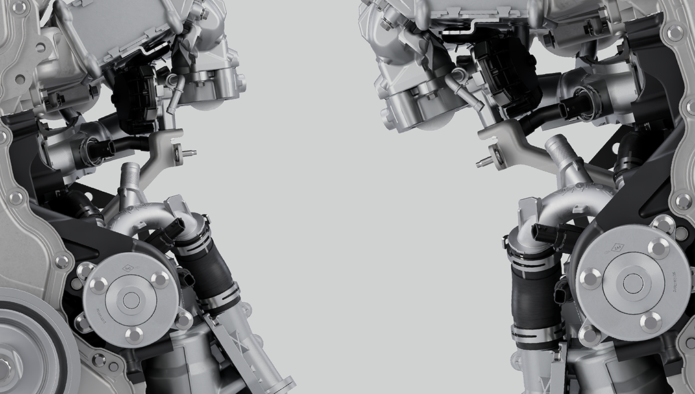 A close up of two almost mirrored looking parts of an engine